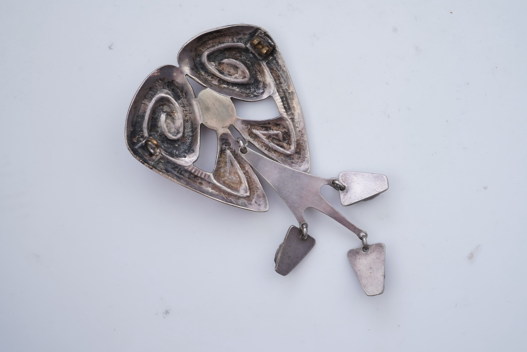 A collection of five Arts & Crafts silver brooches, Denmark, early-mid 20th century